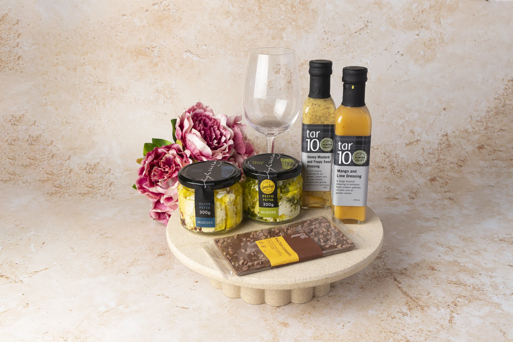 Premium food hamper styled with flowers and glassware